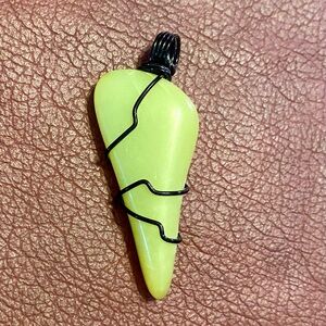 Wire wrapped healerite pendant.
